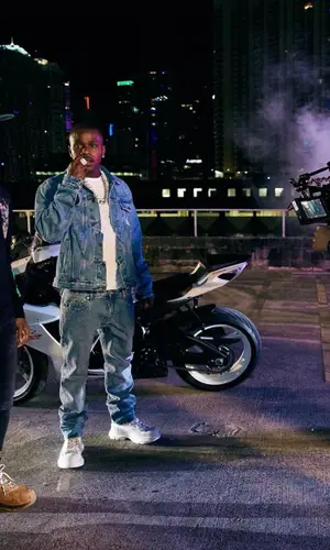 DaBaby wearing Alexander McQueen boots