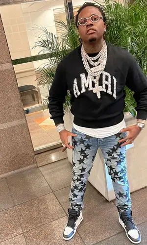 Gunna wearing Amiri sweatshirt