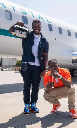 DaBaby wearing Amiri jeans