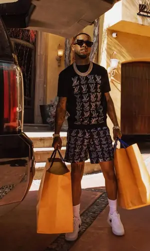 Tory Lanez wearing Louis Vuitton shorts