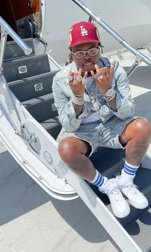 Gunna wearing Jon Stan cap