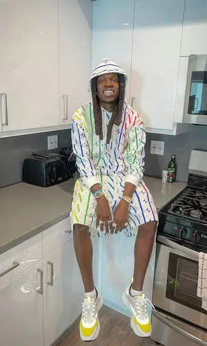 Foolio wearing Valentino sneakers