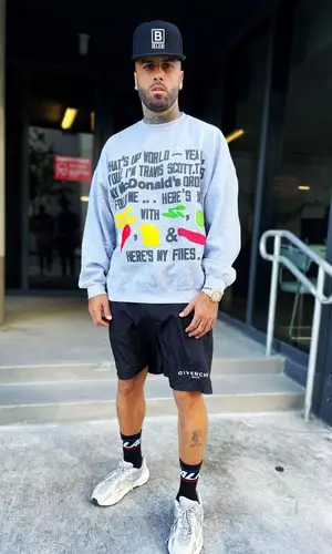 Nicky Jam wearing Travis Scott Merch jacket