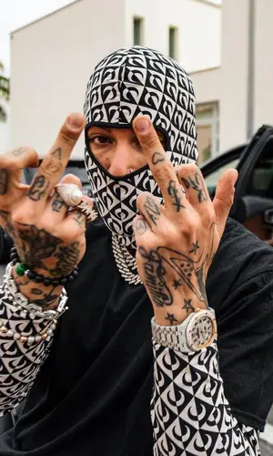 Sfera Ebbasta wearing Marine Serre other