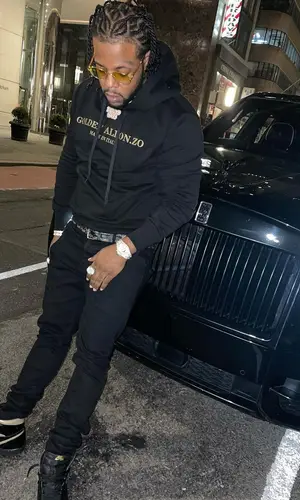 Rowdy Rebel wearing Goyard belt