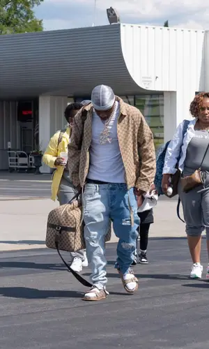DaBaby wearing Gucci backpack