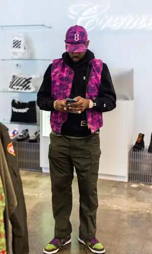 Fabolous wearing Louis Vuitton backpack