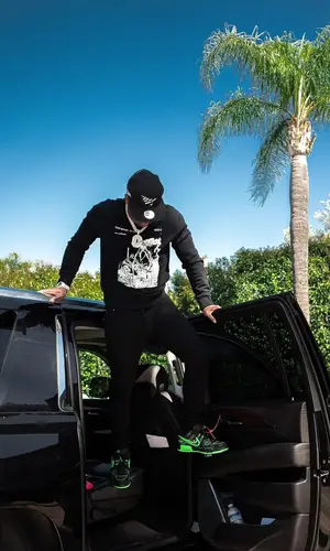Yo Gotti wearing Off-White sweatshirt