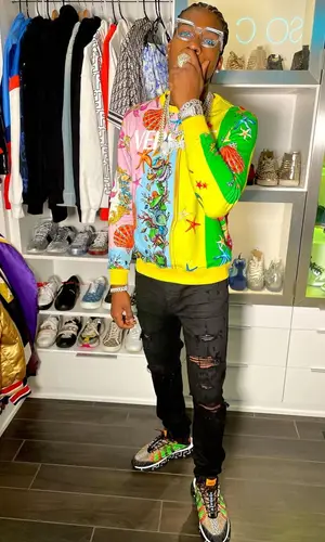 CJ So Cool wearing Versace sweatshirt