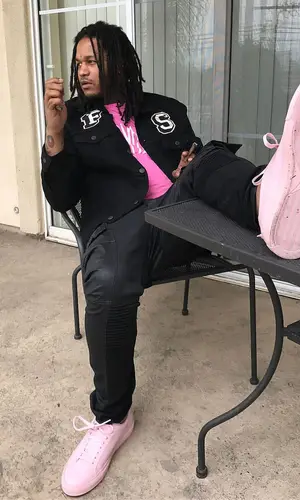Fredo Santana wearing Savage Squad Records Merch t-shirt
