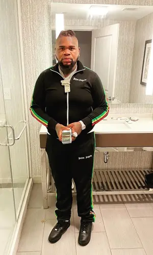 Fat Boy wearing Palm Angels pants