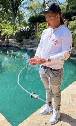 Lil Gotit wearing Purple Brand jeans
