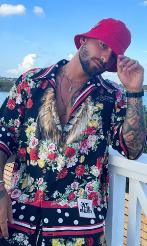 Maluma’s Outfit in Dolce & Gabbana Shirt, Jordan Sneakers & Prada Hat (2021)