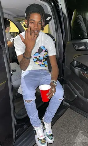 Jhacari wearing Jaycee Customs sneakers