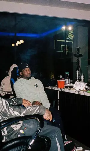 Murda Beatz wearing Broken Promises shorts