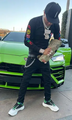 Lil Migo wearing Louis Vuitton backpack
