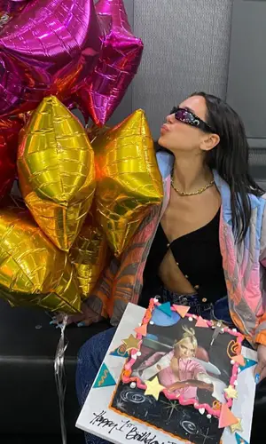 Dua Lipa wearing Versace shirt