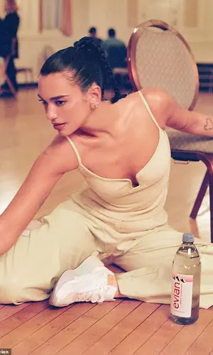 Dua Lipa wearing Paris Georgia trousers