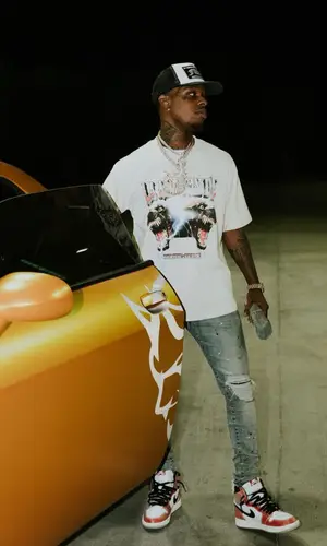 Toosii wearing Chrome Hearts hat