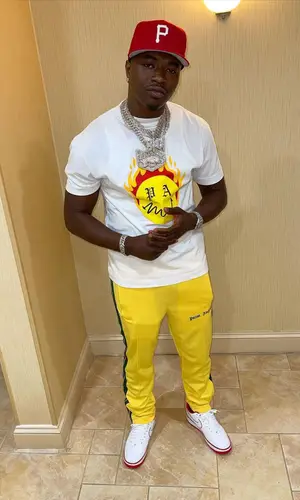 Bankroll Freddie wearing New Era cap
