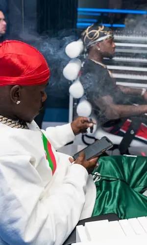 DaBaby wearing Amiri trousers