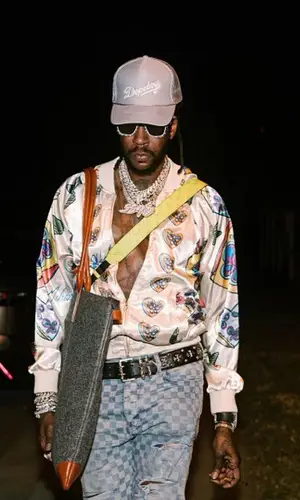 2 Chainz wearing Louis Vuitton bag