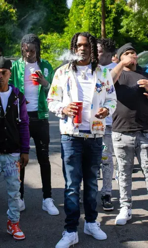 Young Nudy wearing Giuseppe Zanotti belt