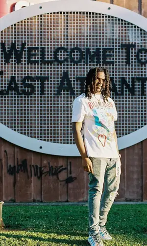 Young Nudy wearing Versace sneakers