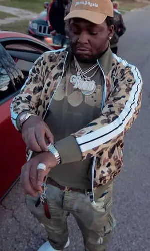 Rio Da Yung Og wearing Louis Vuitton belt