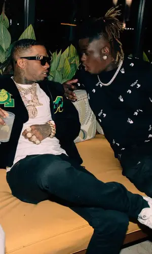 Tory Lanez wearing Amiri jeans