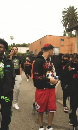 Lil Bibby’s Outfit in Juice Wrld Merch Hoodie, Mitchell & Ness Shorts & Vlone (2021)