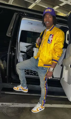 Lil Baby wearing Louis Vuitton backpack