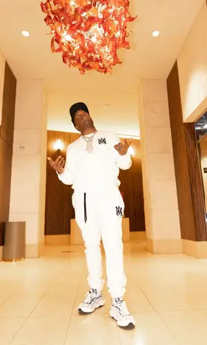 Yo Gotti wearing Amiri sweatshirt