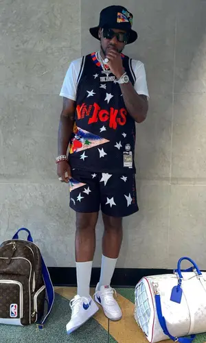 Fabolous wearing Louis Vuitton backpack