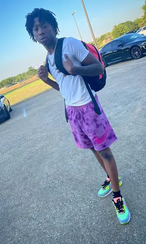 Lil Loaded wearing Nike shorts