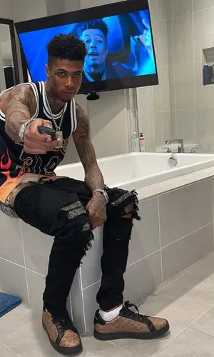 Blueface’s Outfit in Mitchell & Ness Jersey, Amiri Jeans & Coach Belt (2021)