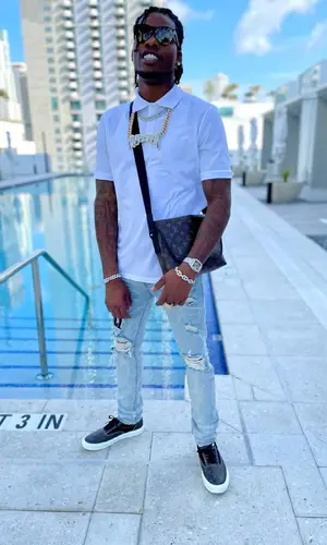 CJ So Cool wearing Louis Vuitton bag