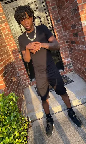 Lil Loaded wearing Levi’s shorts