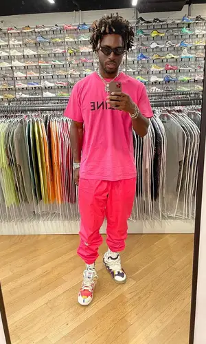 Saint JHN wearing Nike pants
