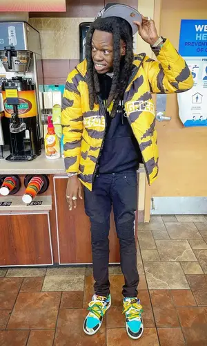 Foolio wearing Nike sneakers