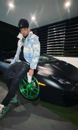 Smokepurpp’s Outfit in Lacoste Jacket, Off-White Sneakers & Chrome Hearts Hat (2021)