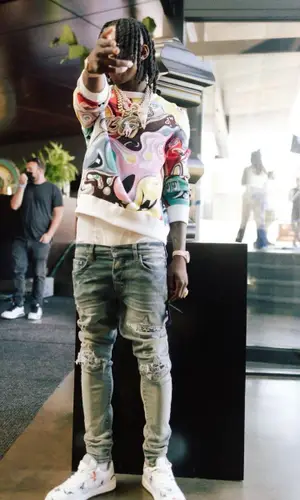 Polo G wearing Dior sweater