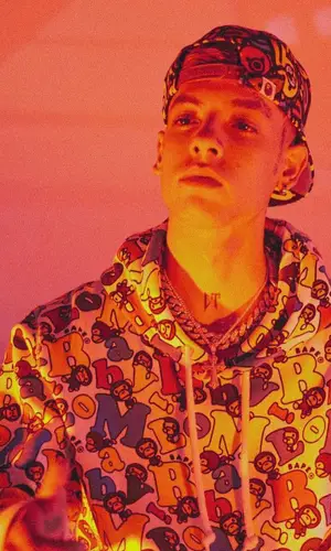 Natanael Cano wearing Louis Vuitton bag