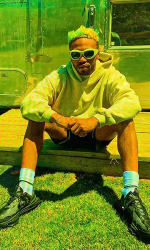 Kevin Abstract wearing Holiday hoody
