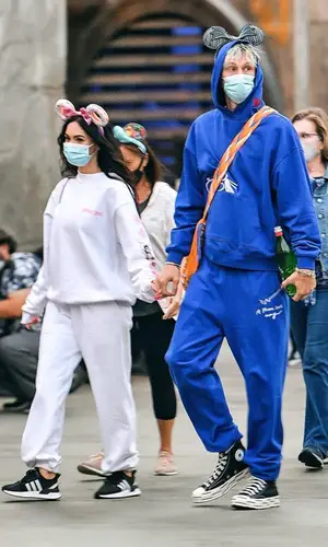Megan Fox’s Outfit in Chrome Hearts Hoodie, Prada Bag & Disney Cap (2021)
