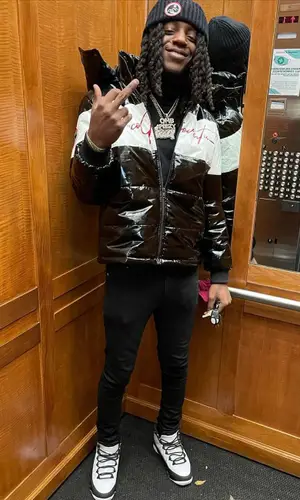 OMB Peezy wearing Ricco Gioventu jacket