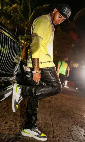 CJ wearing Givenchy t-shirt