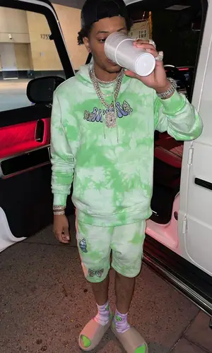 Lil Migo wearing Yeezy sandal