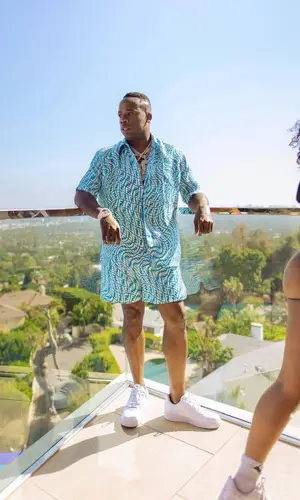 Yo Gotti wearing Fendi shirt