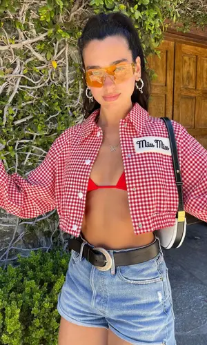 Dua Lipa wearing Dsquared2 boots